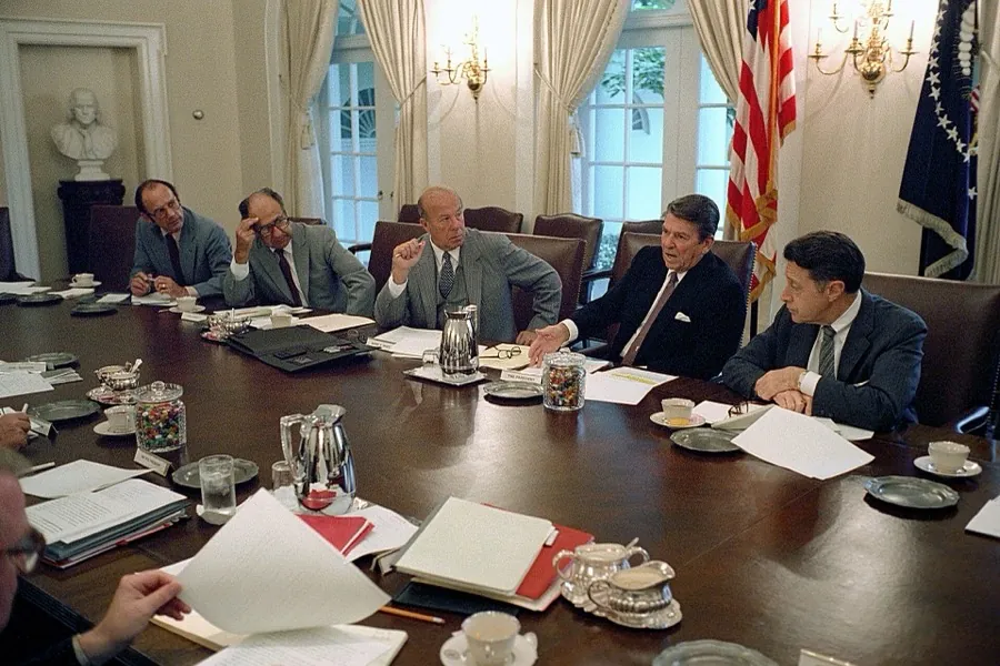 President Ronald Reagan in a National Security Council meeting in the Cabinet Room with George Shultz and Caspar Weinberger